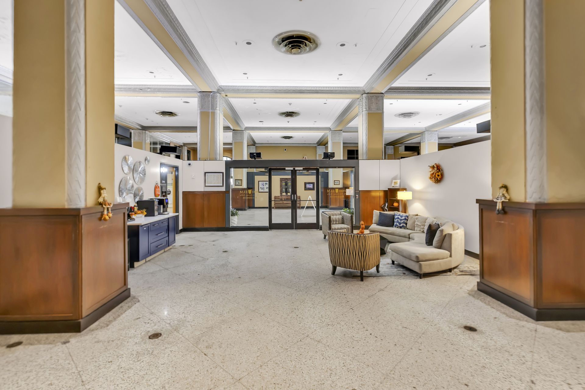 Terrazzo lobby of 1900 Elm with square columns and seating