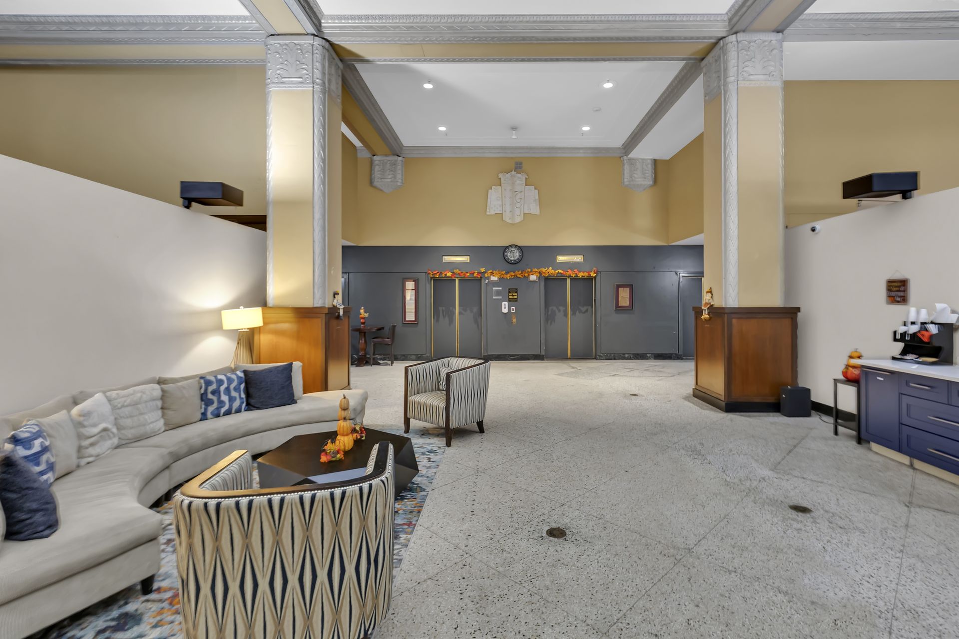 Lobby seating area in front of the elevators at 1900 Elm Lofts