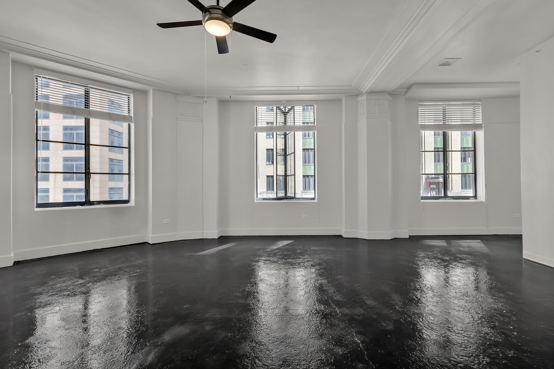 Open casement window with downtown Dallas view, 1900 Elm Lofts